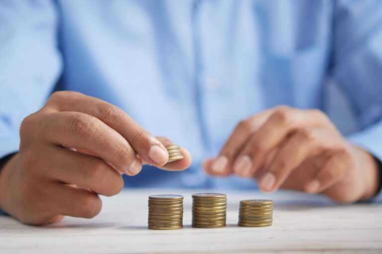 Man stacking coins